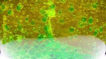 Bubbles form as acid reacts with baking soda experiment close up video
