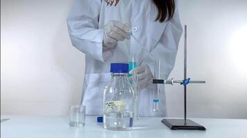 Chemist conducts experiment with chemical reaction video