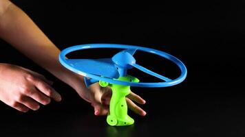 Hand operate a pull string flying toy video