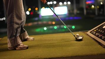 Golfer misses swing at driving range video