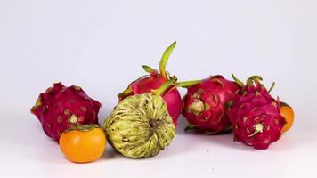 Hands selecting fruits from a colorful arrangement video