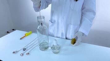 Scientist conducts chemical experiment with glowing effect video