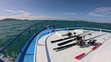 A serene boat ride with fishing gear on a sunny day in Phuket, capturing the ocean's beauty and tranquility video