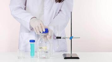 Scientist conducts NaOH reaction in laboratory setting experiment video