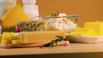 Various dairy items arranged on a table , cheese, milk video