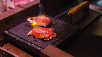 Steak being seasoned and grilled to perfection video