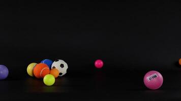 Various balls moving across a dark background video