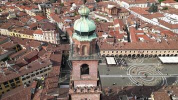 Aerial view Bramante Tower in Vigevano Italy. A Renaissance square with arcades and a cathedral, today it houses bars, restaurants and shops. video
