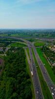 Traffic on a motorway in Milan on a sunny day as seen from a drone video