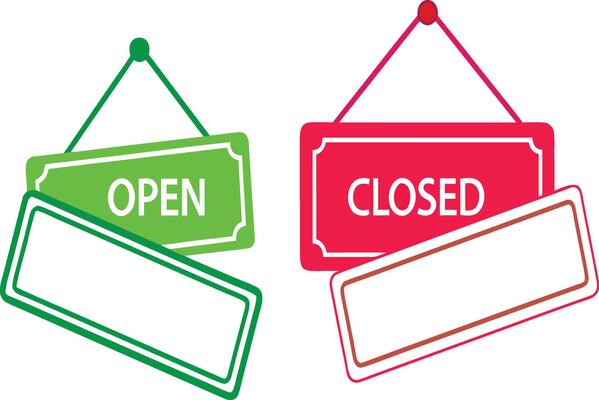 Open and closed signs hanging on white background with blank space.