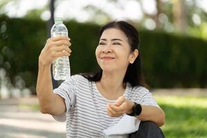 Seniors celebrating hydration and positivity in the park photo