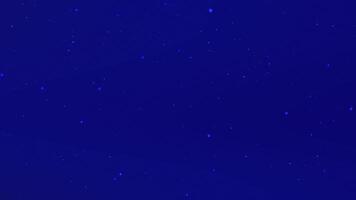 Night sky filled with twinkling stars over a calm ocean, creating a serene atmosphere video