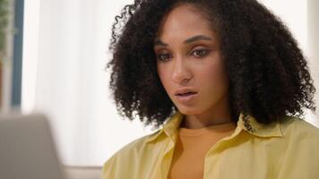 African American shocked woman businesswoman sad anxious business girl confused negative bad emotion notification on laptop computer app problem lost stunned amazement shock failure loss money at home video