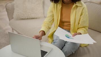 African American woman businesswoman work with paper sales trade stats talk to client call discussing graphs diagrams young girl student studying at home distant education with laptop computer video