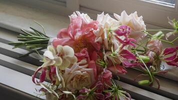 A Stunning and Beautiful Floral Bouquet Displayed on a Bright Windowsill in a Lovely Home setting. Action video