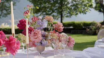 An Elegant Outdoor Floral Table Setting Crafted Beautifully for a Joyful Celebration Event. Action video
