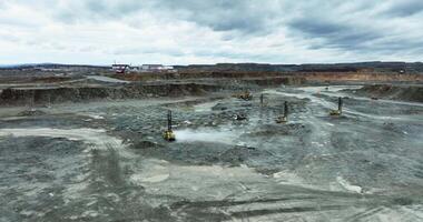 Quarry mining operations with heavy machinery and dust. Stock clip video