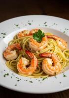 Spaghetti with shrimp, garlic, and parsley in a white bowl. photo