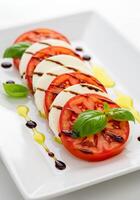Classic Italian Caprese Salad with Balsamic Glaze. photo