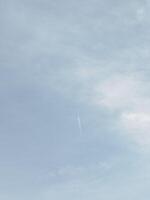 A man is flying a kite in the sky photo