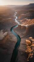 Scenic River Carving Through Majestic Desert Canyons at Sunrise photo