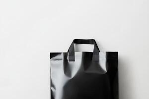 Black reusable shopping bag on a clean white background suitable for eco-friendly themes and product displays photo