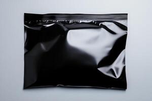 Black sealed packaging bag on a neutral background ideal for product display or branding purposes photo