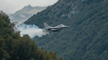 Jet Airplane Soars Through Mountain Valley with Aerial Acrobatic Maneuvers and Vapor Trails. Flight, Aviation, Aircraft. photo