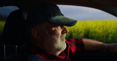 Tired Old Farmer Sitting Alone In Car In Agricultural Field, Cinematic Portrait Of Agronomist video