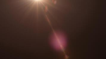 Abstract gold optical flare ligjt moving from top left to right video