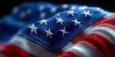 The american flag is waving, showing its stars and stripes in great detail and texture. photo