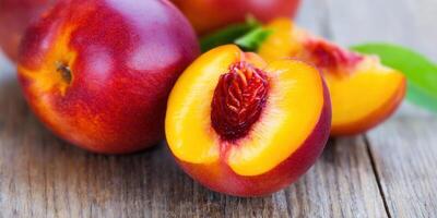 Vibrant close-up of a sliced nectarine, revealing juicy flesh and vivid colors. photo