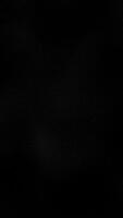 Gently rippling wavy dots pattern vertical background. This simple dark minimalist animation is full HD and a seamless loop. video