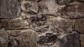 Rustic stone wall texture stop motion background. Full HD and looping textured background. video