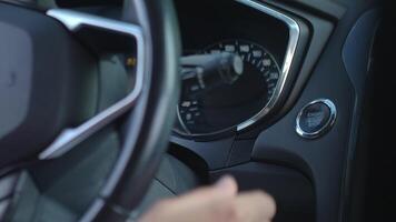 Close-up of hand pressing start button to turn on car engine. Keyless ignition system in modern car video