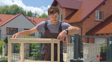 Man measuring wooden board during carpentry work video