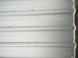 Close-up of Light Gray Corrugated Metal Roofing with Subtle Imperfections photo