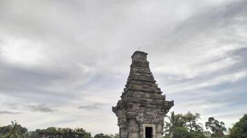 Majestic Ancient Temple Tower Against Cloudy Sky photo
