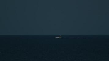 Small Boat Moves In The Night In The Ocean In Summer On The Horizon video