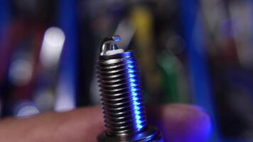 Close-Up View of a Spark Plug with Industrial Background video