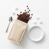 Coffee Beans Spill from Kraft Bag with Sugar Cubes and Spoon on White photo