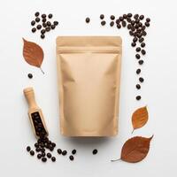 Coffee Bean Packaging with Autumnal Leaves and Wooden Scoop, Flat Lay photo