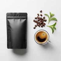 Coffee Composition Black Pouch, Espresso, Beans, and Green Leaves on White photo