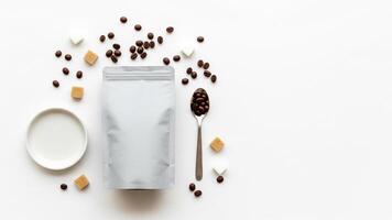 Coffee Beans, Sugar Cubes, and Silver Pouch on White Background, Flat Lay photo