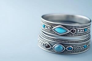 Close-up of Two Silver Rings Adorned with Turquoise and Garnet Stones. These intricately designed rings showcase beautiful gemstone details. photo