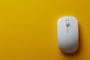 White Computer Mouse on Vibrant Yellow Background Minimalist Technology Image. photo