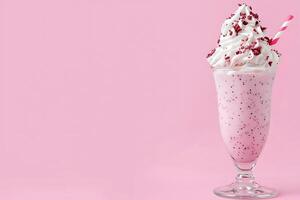 Delicious Pink Milkshake with Whipped Cream and Sprinkles on a Pink Background. A refreshing summer treat, perfect for menus, websites, or advertisements. photo