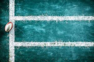 American Football on Grunge Field End Zone Background. A textured, teal-colored field with white lines and a football, perfect for sports-related designs. photo