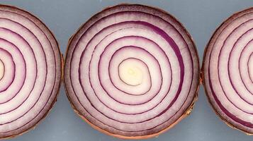 Vibrant Red Onion Slices Reveal Concentric Layers in Close Up. photo