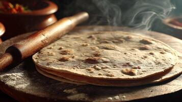 Freshly Made Flatbreads with Steaming Aroma and Rustic Rolling Pin. photo